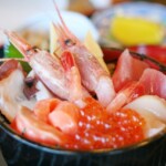 Bowl of rice topped with sashimi