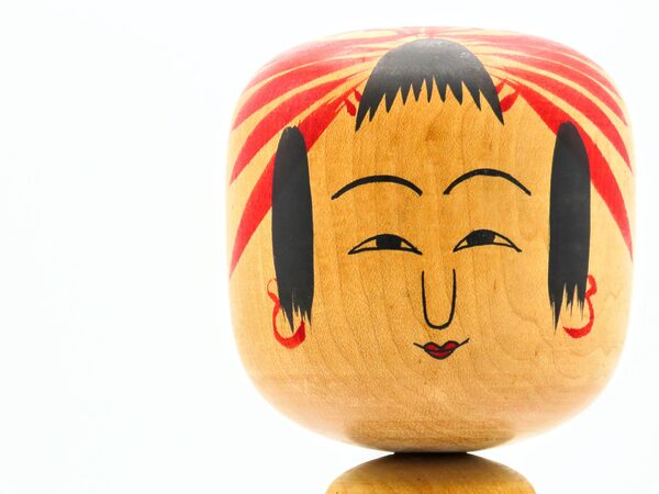The facial expression of Hijiori Kokeshi dolls
