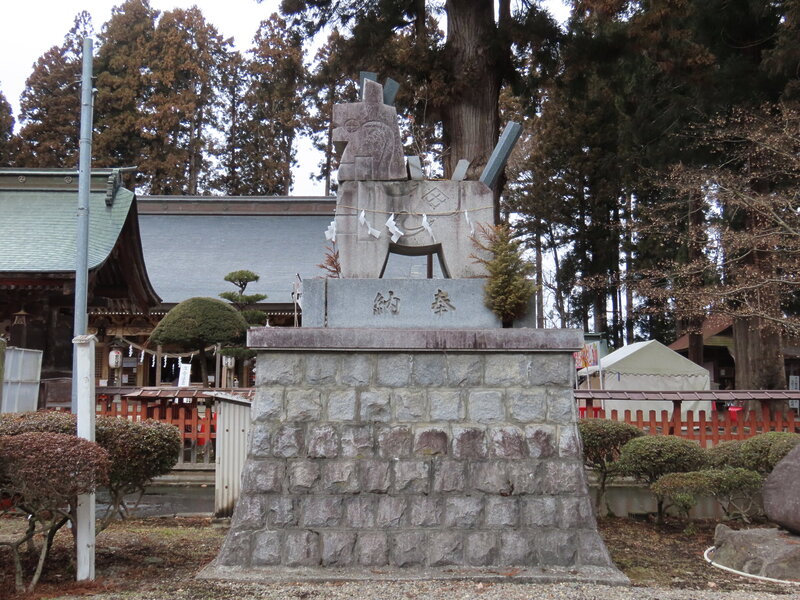 Hachiman horse stone statue carved with a divine horse