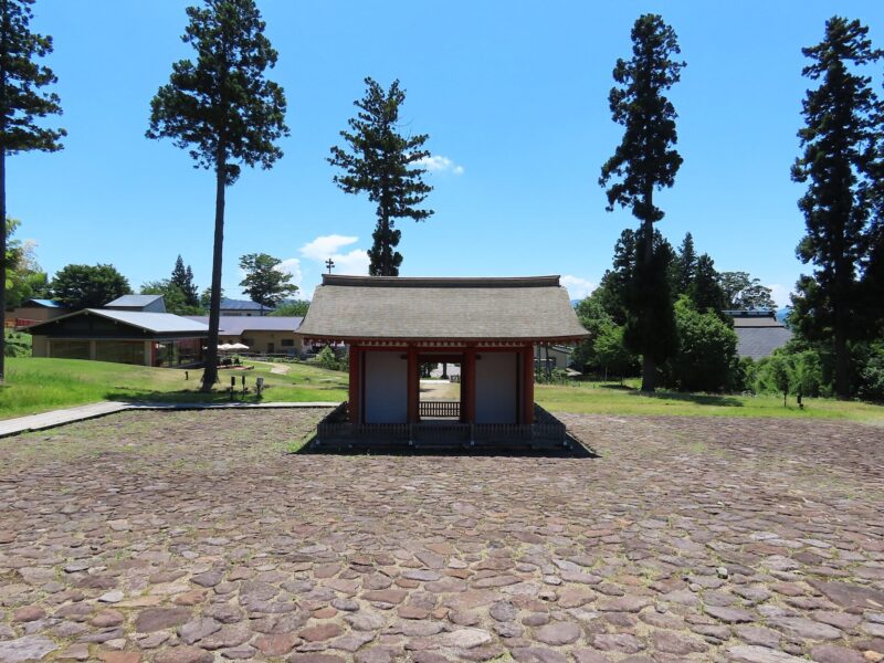 Stone-paved plaza and inner gate seen from the main hall