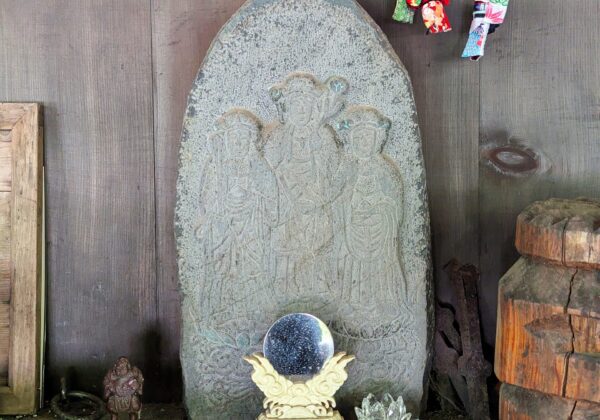 A stone slab engraved with the three goddesses at Kamitsari Shrine