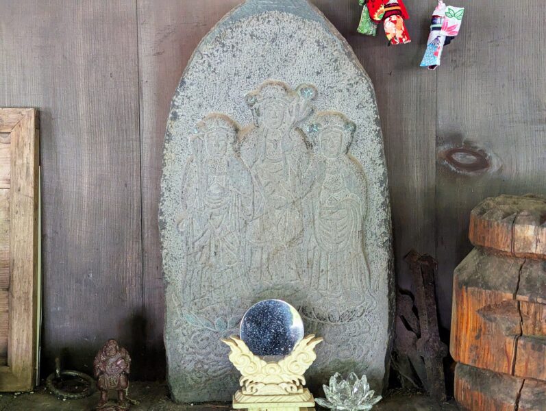 A stone slab engraved with the three goddesses at Kamitsari Shrine