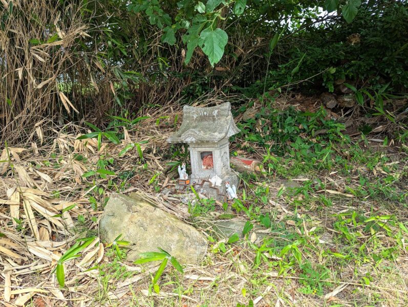 A stone shrine that appears to be dedicated to Inari (the fox deity)
